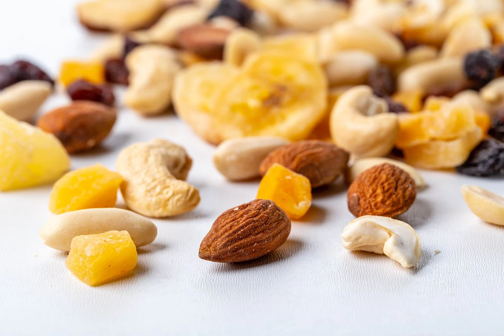 Dried fruits and different nuts on white background | Flickr